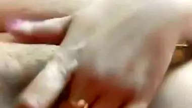 Chubby, young lady enjoys fingering her shaved pussy