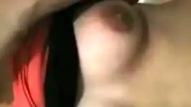 Pink T-shirt is pulled up so Indian sex girl can boast about her XXX tits